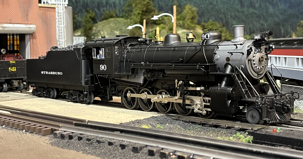 side of black model steam engine