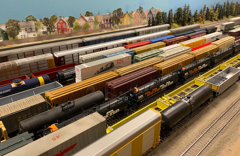 An HO scale rail yard crowded with cars of many types