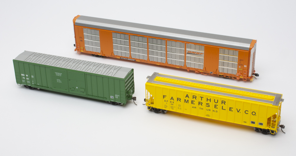 Photo showing three HO scale freight cars.