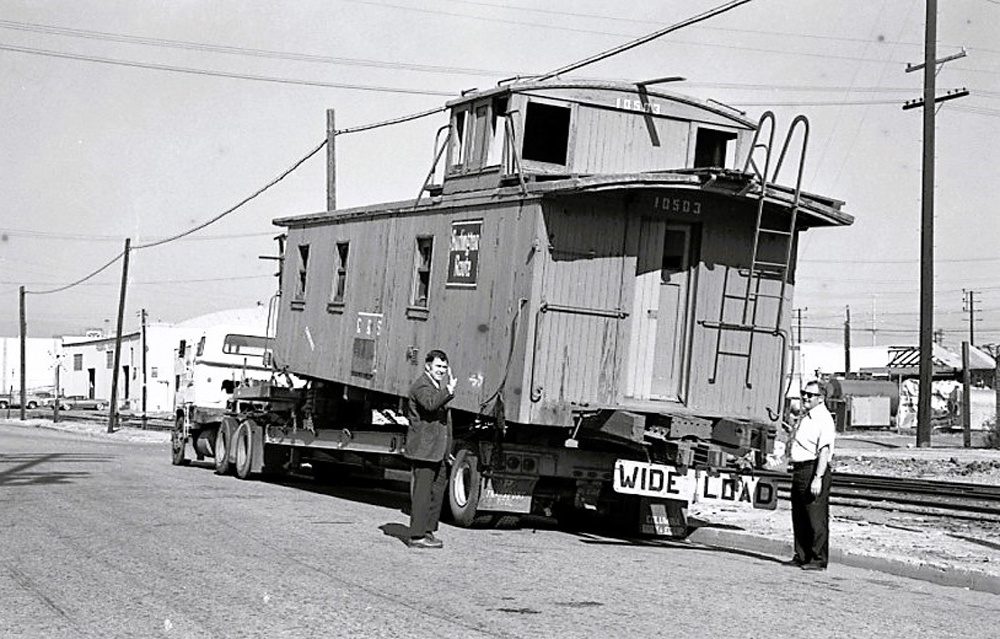 black and white photo of caboose on truck