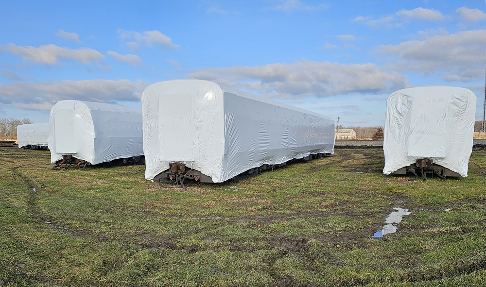 Passenger cars wrapped in plastic
