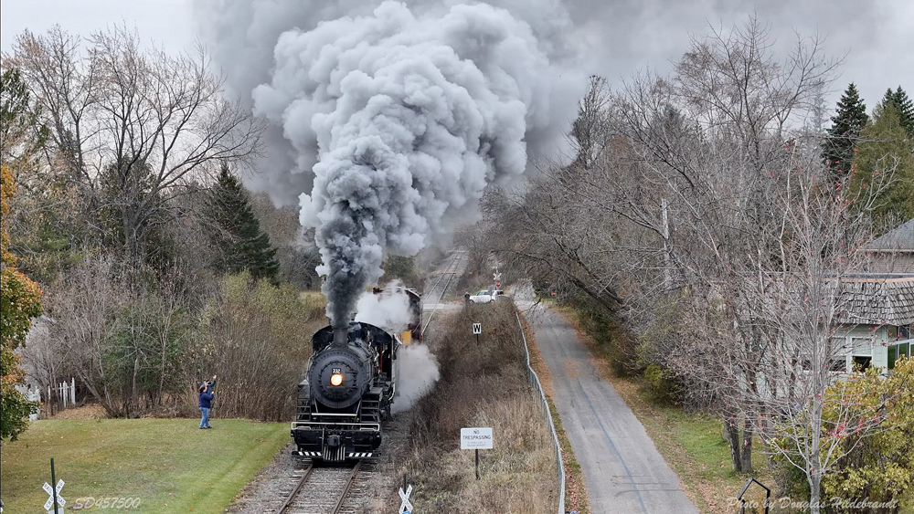 Steam engine under plume of smoke