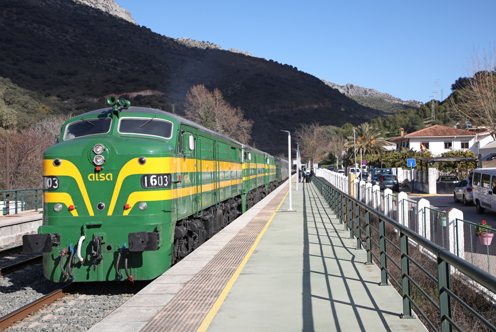 Green and yellow Alco FA-style locomotives on train