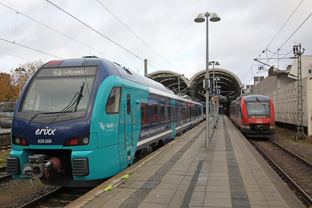 Blue and red trains at station