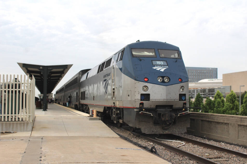 Short passenger train at station platform