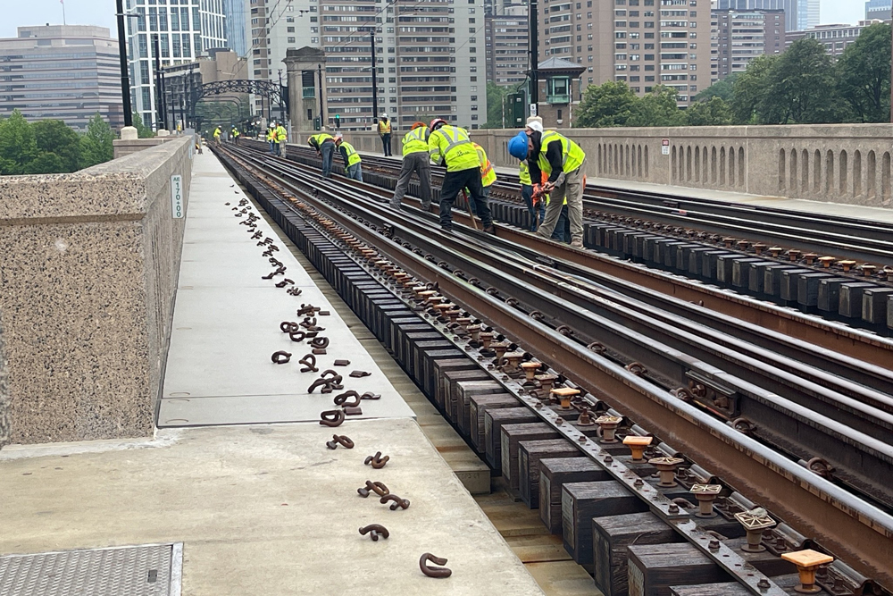 Maintenance workers on rail bridge