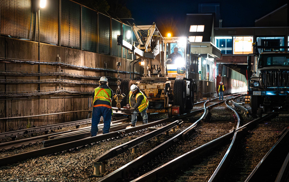 Work crew on rail line at night