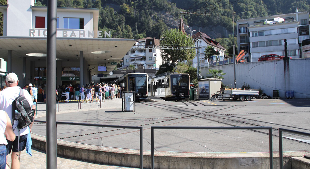 View of train station with crowds from across turntable