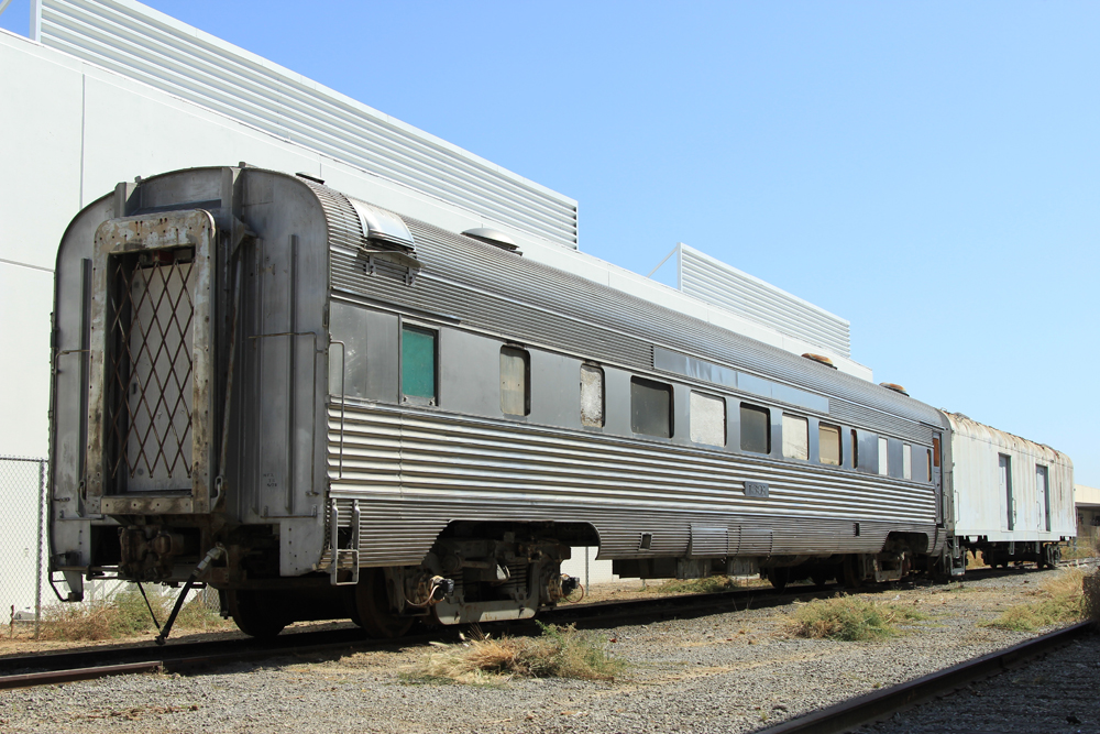 Stainless steel passenger car coupled to baggage car