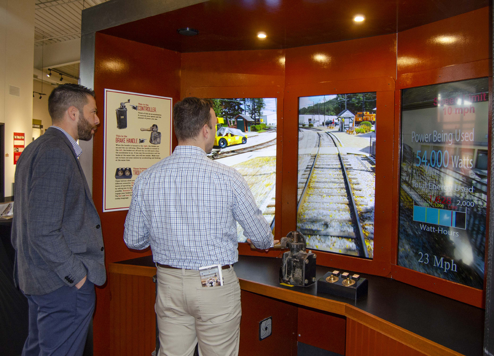 Two men at interactive display at museum