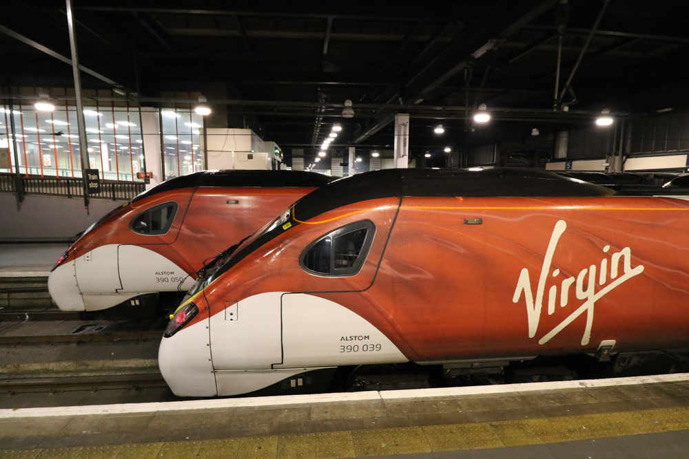 Red and white trains at station