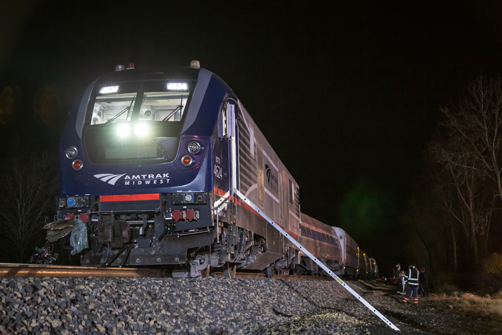 Derailed locomotive at night