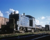 Black diesel Wabash locomotives with freight cars