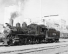 Steam Wabash locomotives with factory behind