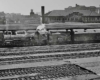 Steam Wabash locomotives with passenger train in city station