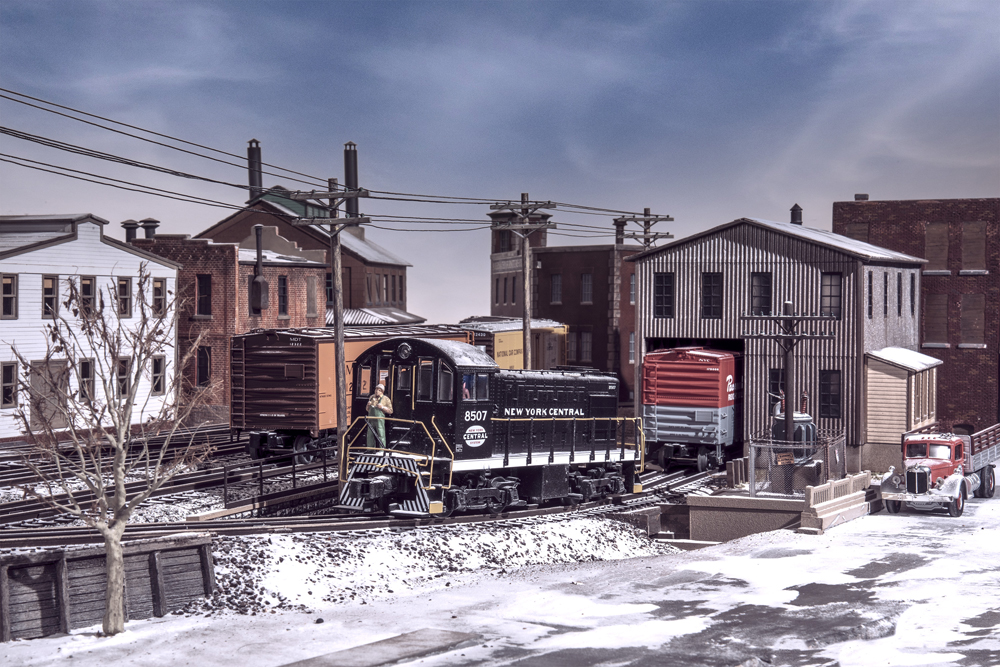 snowy scene with black and white locomotive