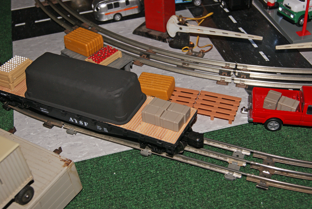 scene on layout with rolling stock hauling load