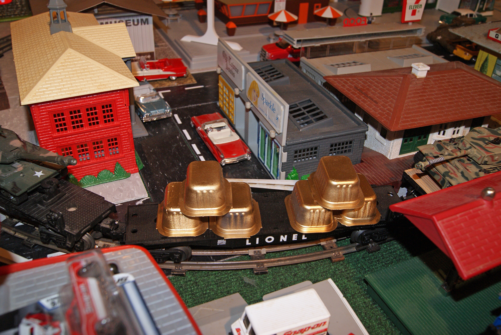 scene on layout with flatcar hauling gold