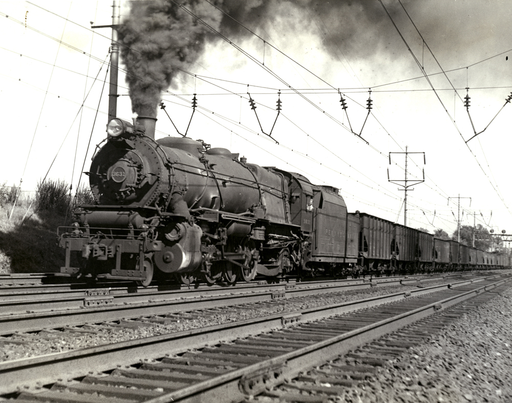 Vintage photo of steam engine and coal cars