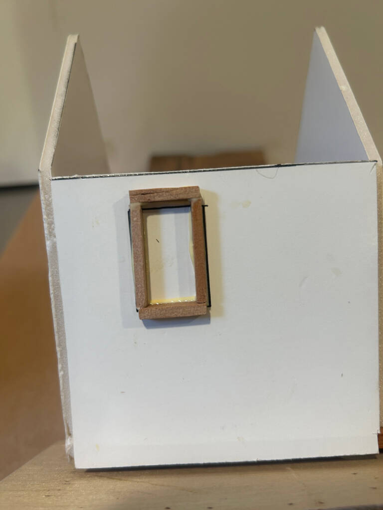 window frame glued on piece of foam