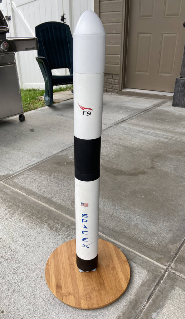 model rocket on a wood base
