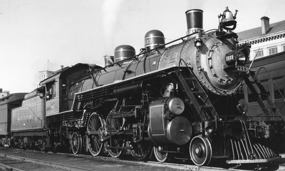 Black-and-white image of a steam locomotive in 3/4 view