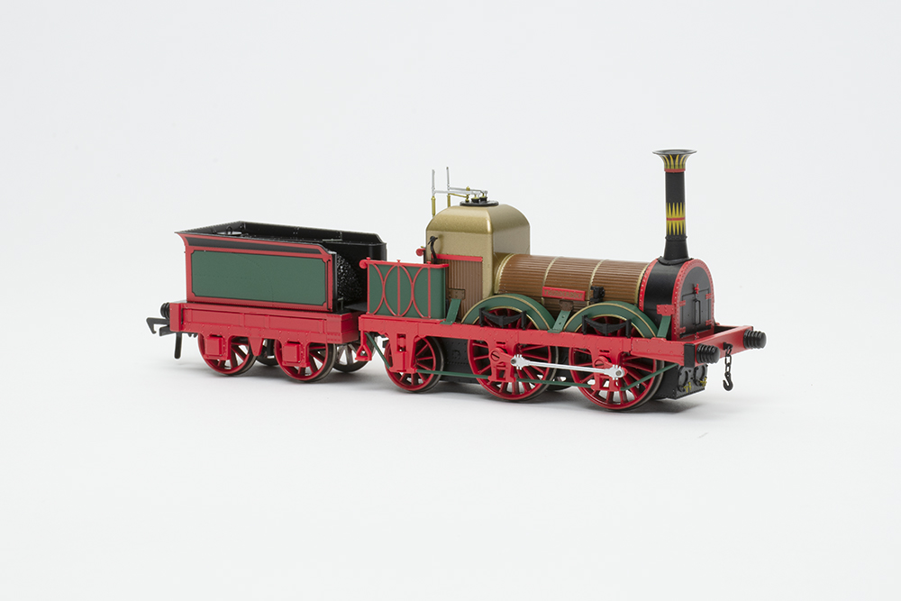 Rapido UK Titfield Thunderbolt: Small, colorful model steam locomotive with green and red 4-wheel tender and open operating cab.