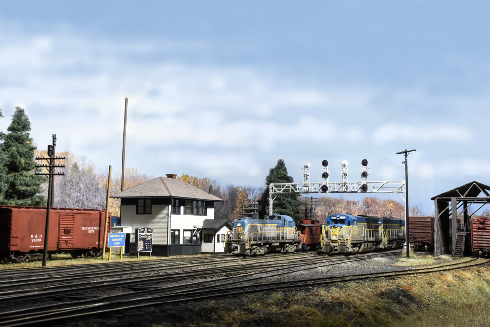 model locomotive scene with structures and a lot of sky