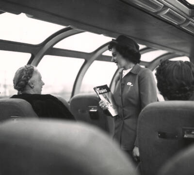 Two women aboard a dome car. Five mind-blowing facts about Christmas and trains.