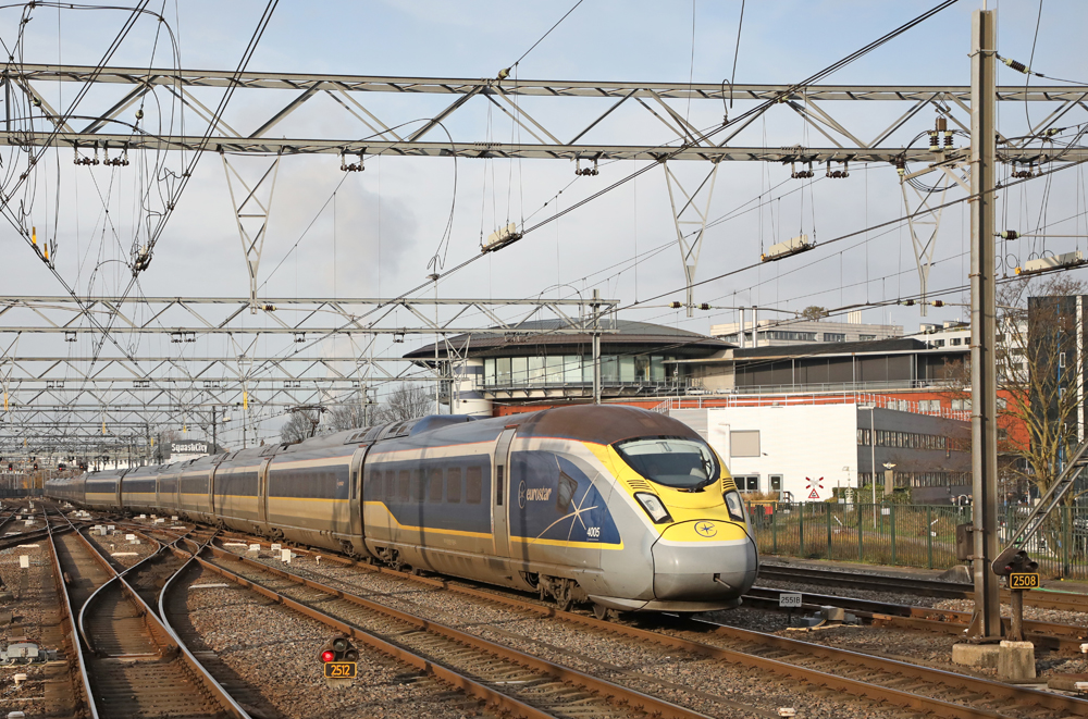 Blue, yellow, and silver high speed train