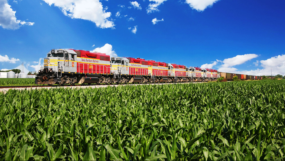 Freight train with seven red, gray, and yellow locomotives