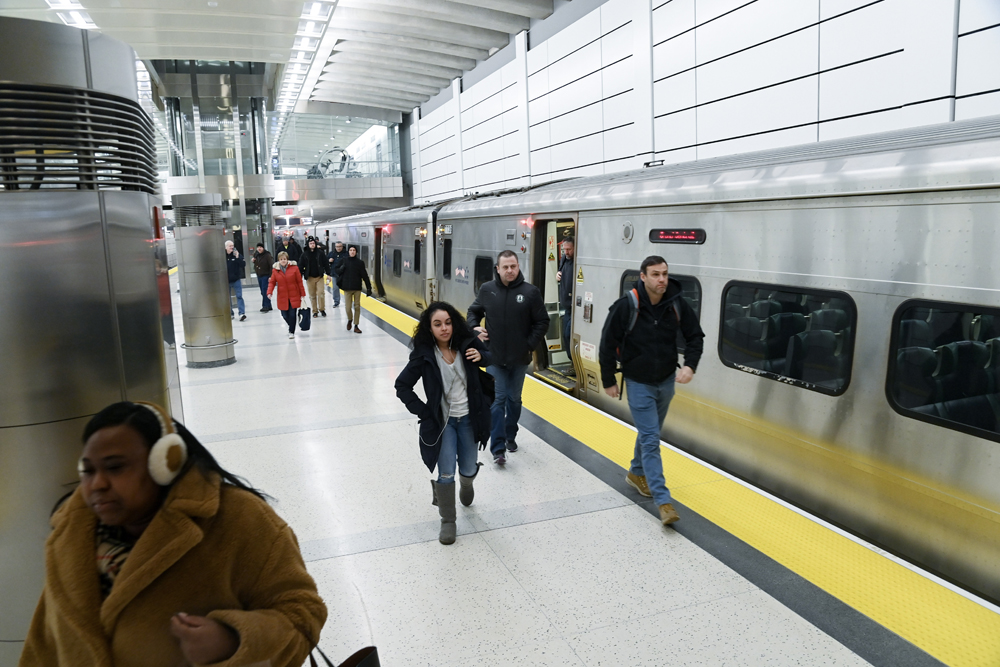 Passengers on platform at underground commuter rail station