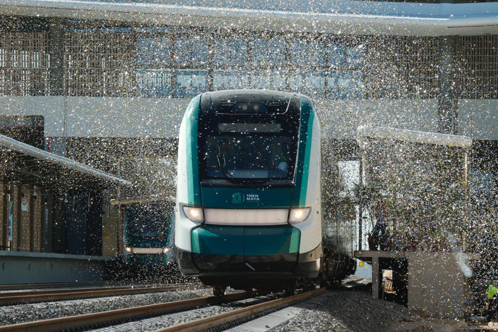 Train passing through shower of confetti