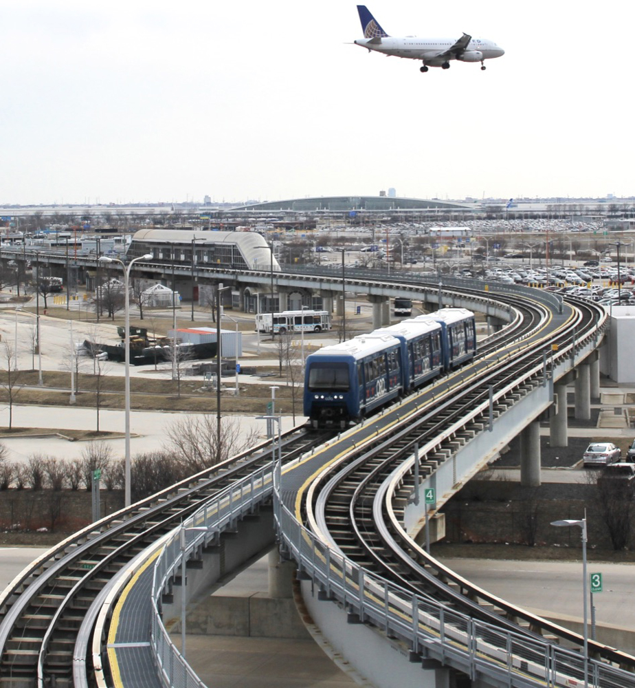 Peoplemover with airplane flying over