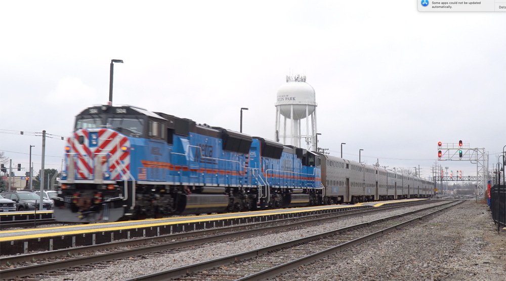 Two blue locomotives on commuter train