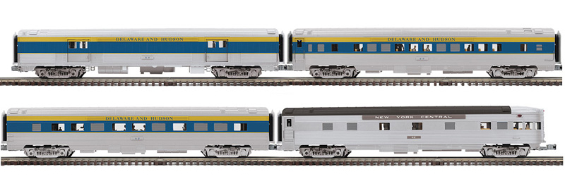 Color photo of four O gauge passenger cars.