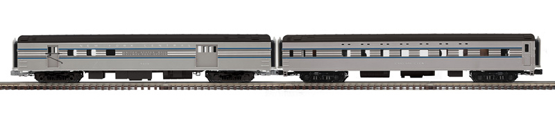 Color photo of two O gauge passenger cars.