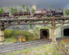 model train on bridge on layout