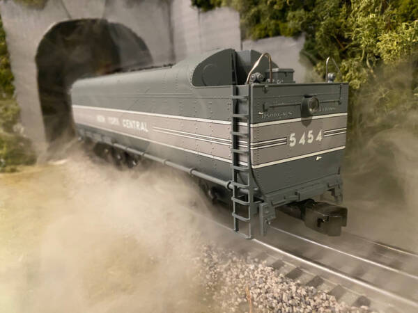 model tender with water vapor around it