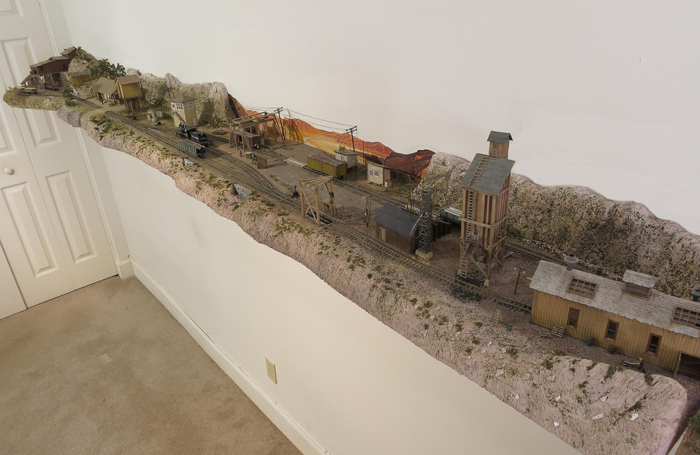 A long view of a narrow shelf model railroad