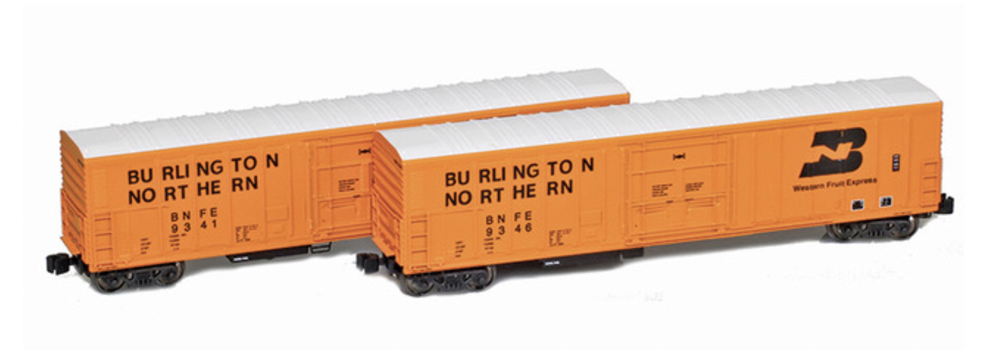 A set of two model boxcars in an orange paint scheme