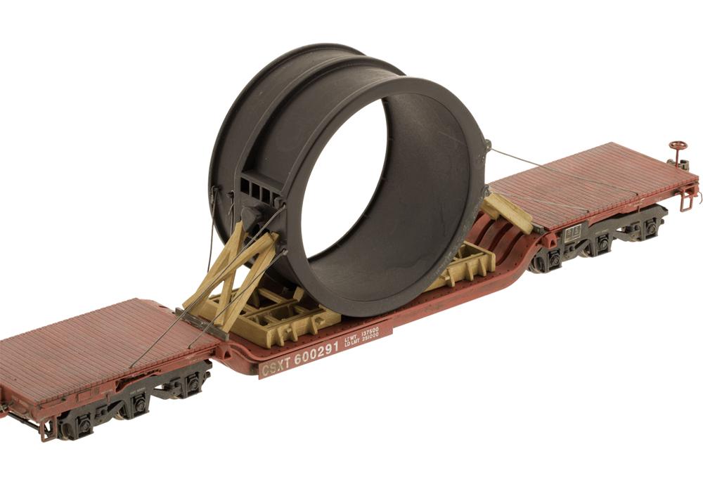 A model flatcar with a steel ladle load