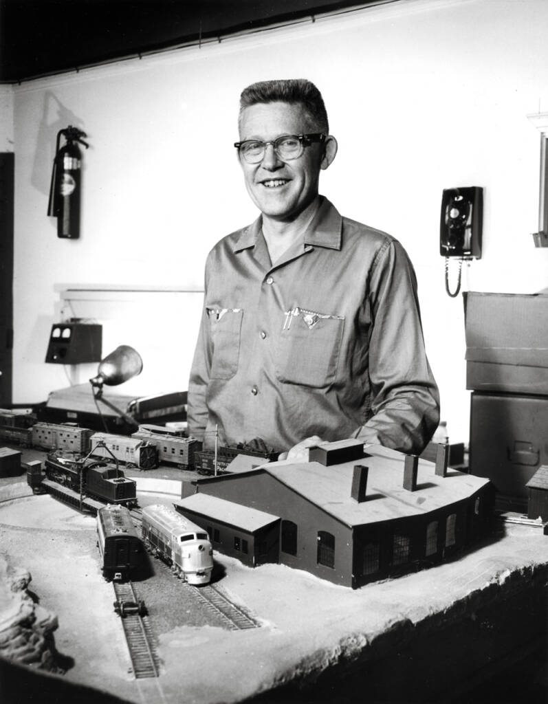 vintage photo of man next to model trains