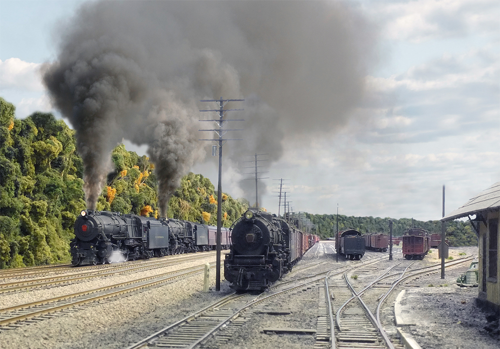 One model train passes another at a yard.