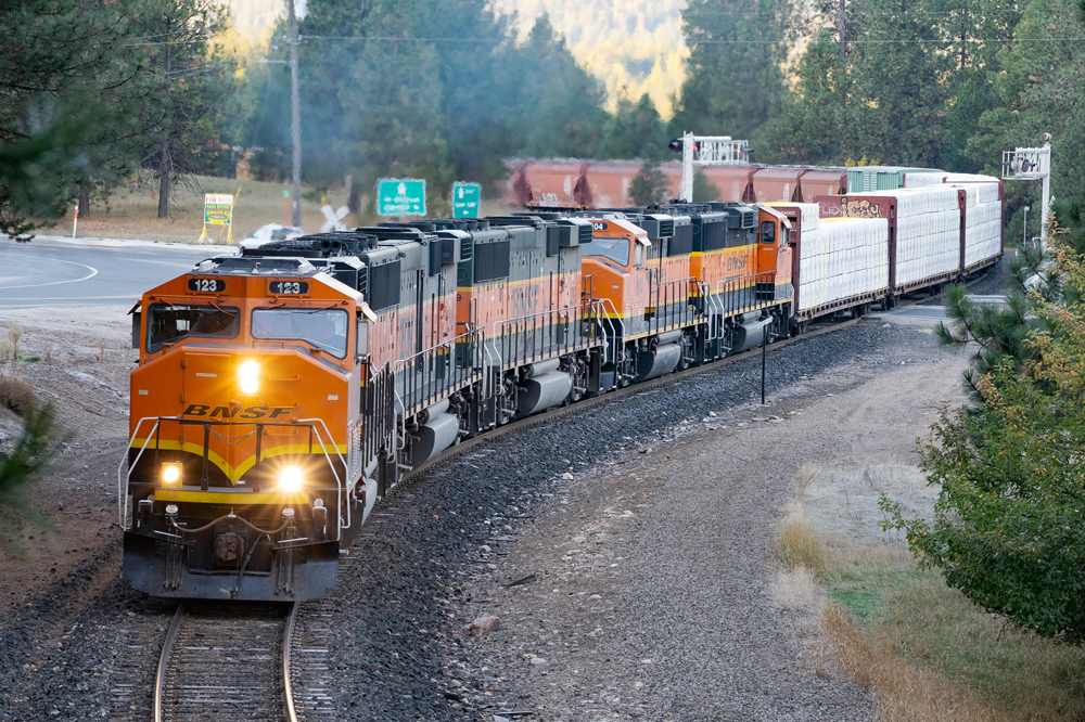 orange BNSF locomotive hauling heavy-tonnage trains