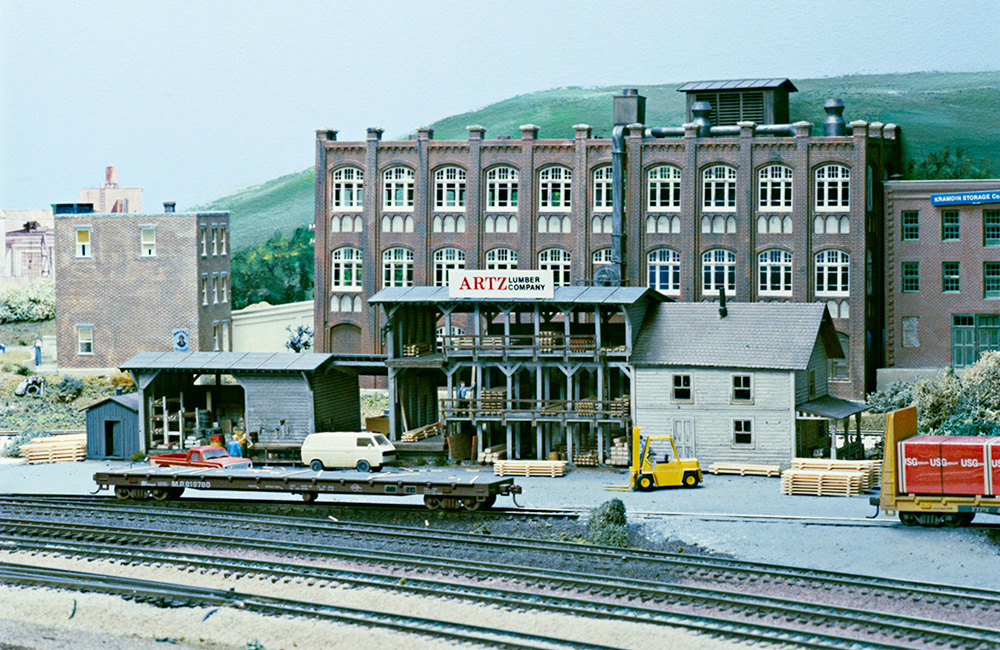 A lumberyard structure on an HO scale model railroad