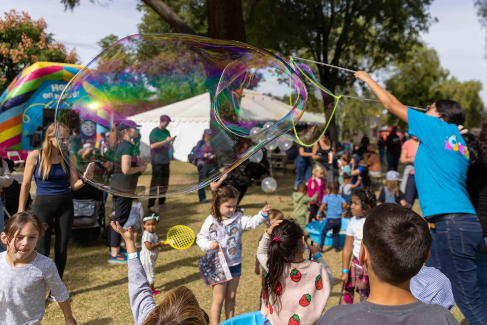 kids playing with bubbles