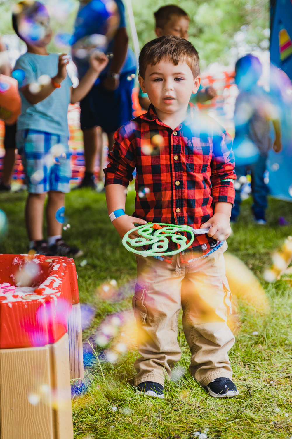 little boy with bubble wand