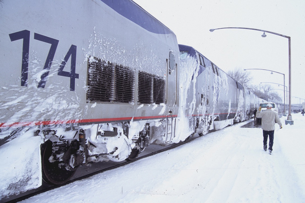 Locomotives coated with snow and ice at station