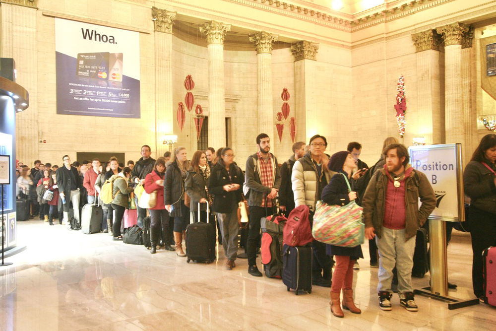 People lined up in Great Hall of train station
